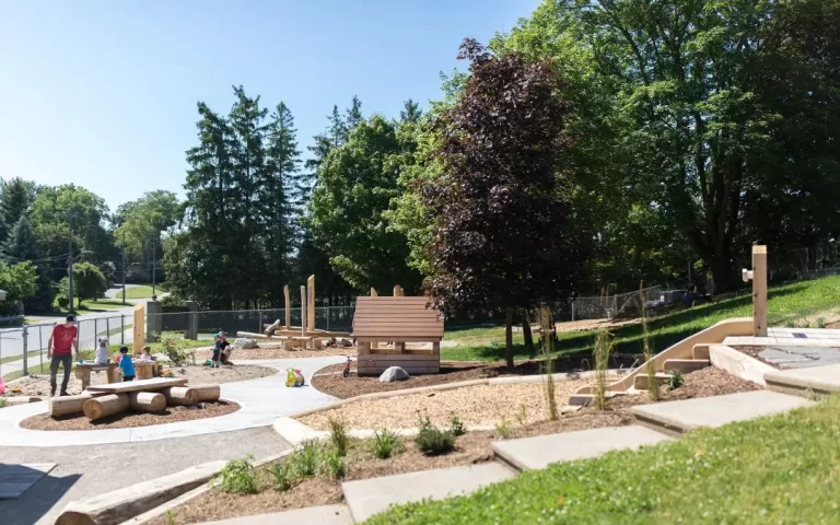 ingersoll child care natural wood playground landscaping hill slide 1080x675 1 jpg 768x480