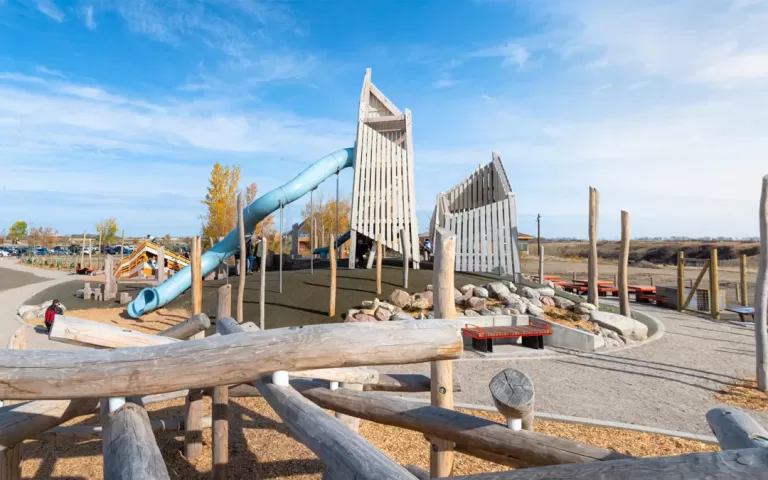 saskatchewan saskatoon natural wood playground log climber abstract towers tube slide 1080x675 1 jpg 768x480