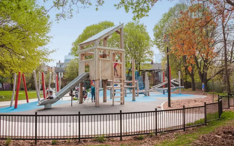 toronto fenced playground natural wood tower slide logs jpg 768x480